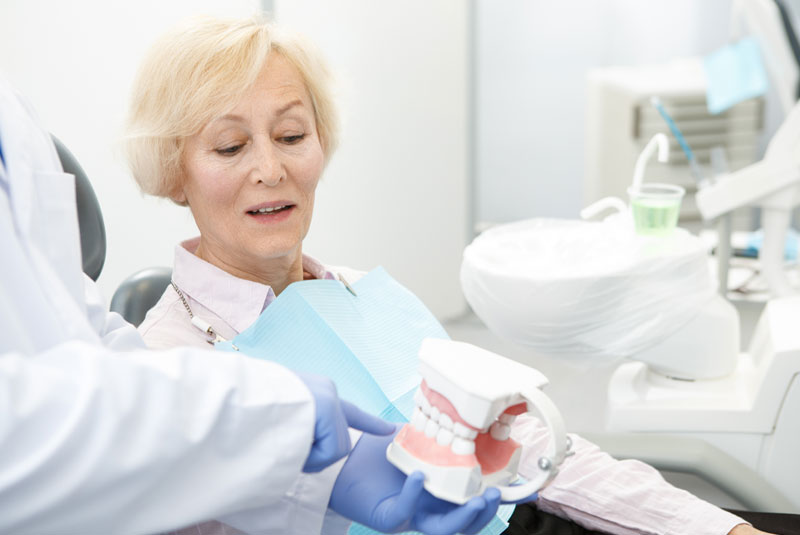 dentalimplantpatient discussing_implantoptions with dentist