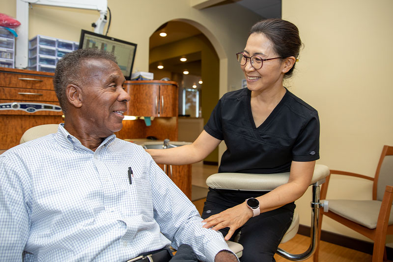 dental patient smiling in exam chair