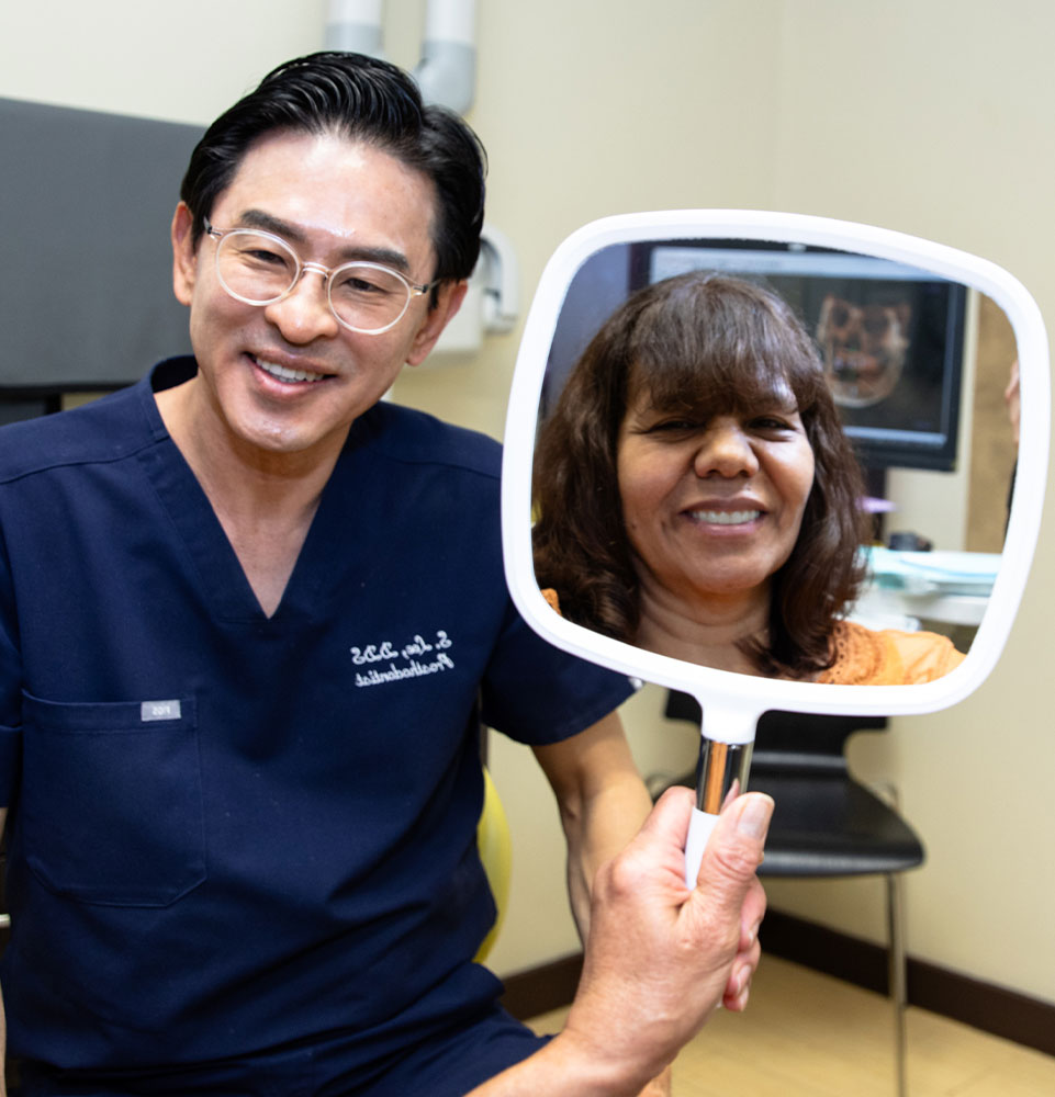 patient smiling brightly after their dental treatment within the dental center