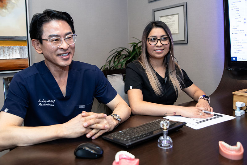 doctor going over dental procedure information with patient