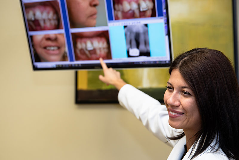 doctor going over dental procedure information with patient