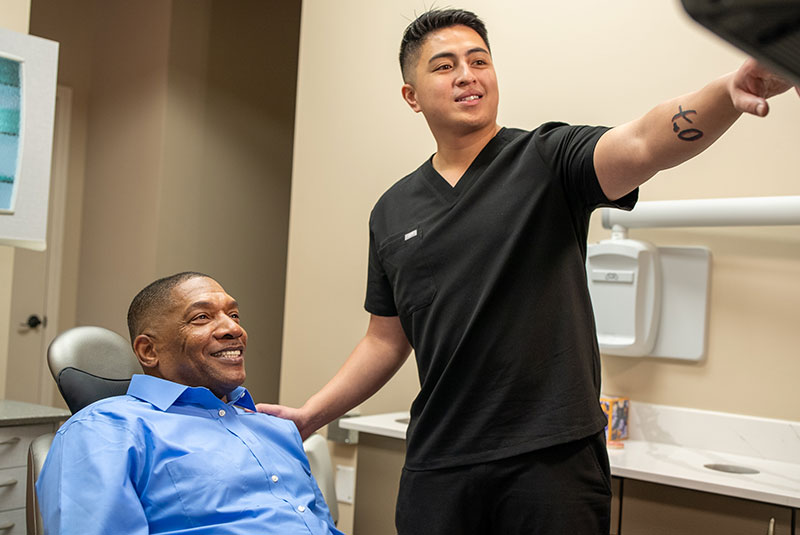 patient and doctor going over dental procedure