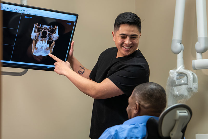 doctor going over dental procedure information